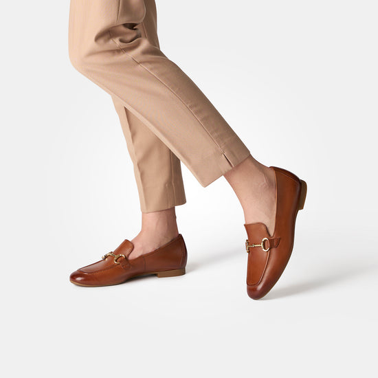 Women in tan pants wearing the Paul Green Daphne in cognac leather view 5